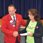 Pam Brasil, of Valley Animal Haven, accepts check from District Governor Al Kroell.
